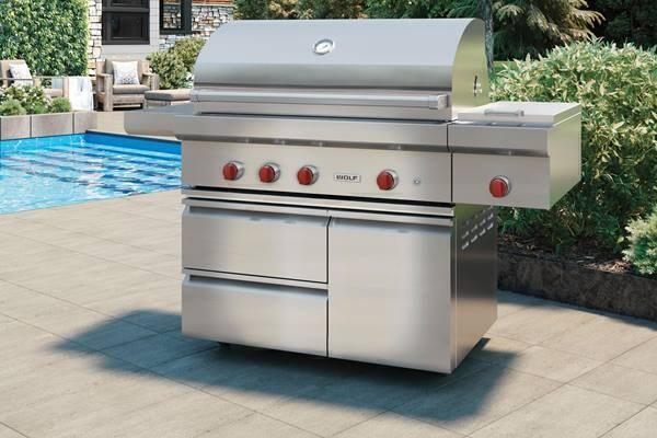 Freestanding outdoor grill by the pool